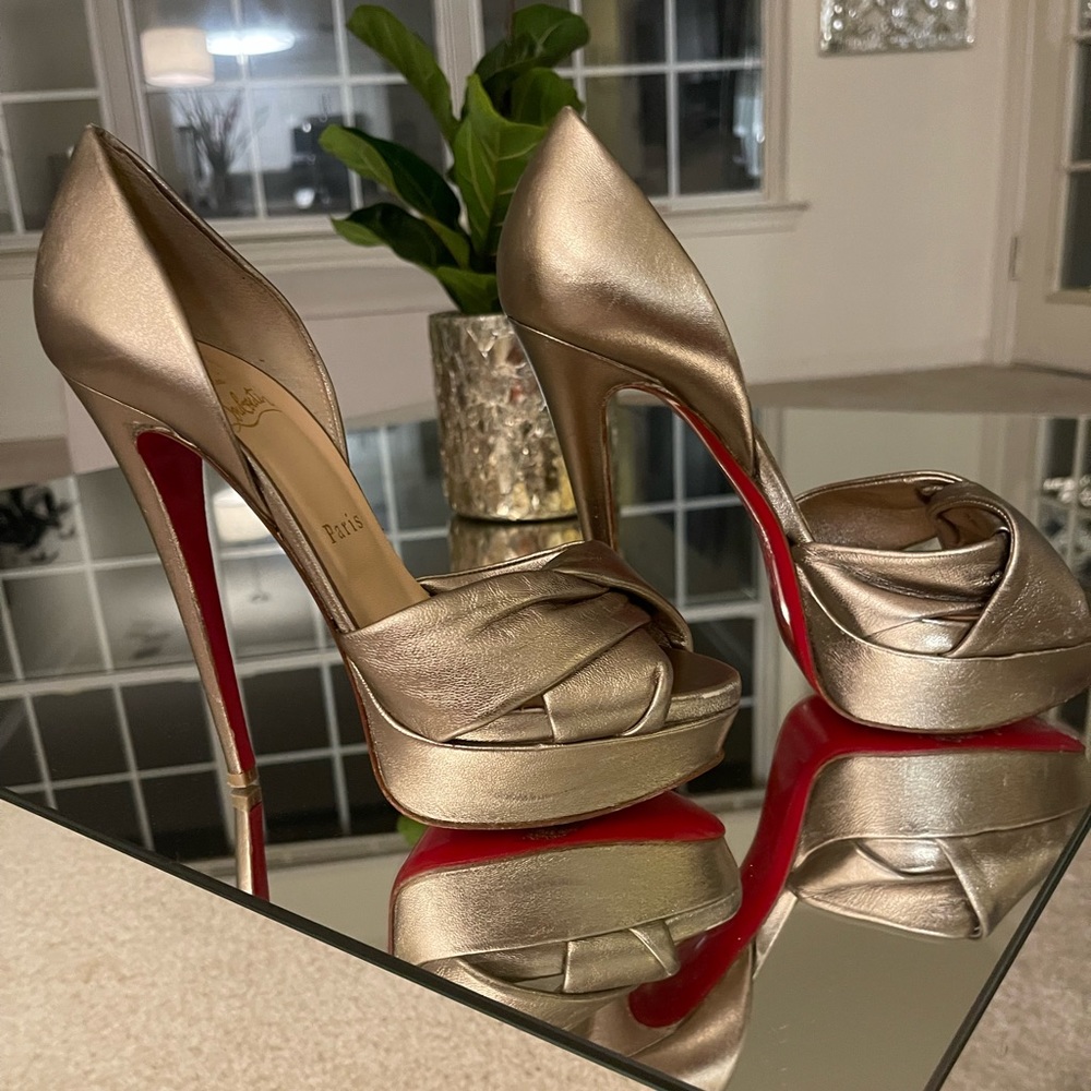 Christian Louboutin 
Champagne Leather Volpi 150